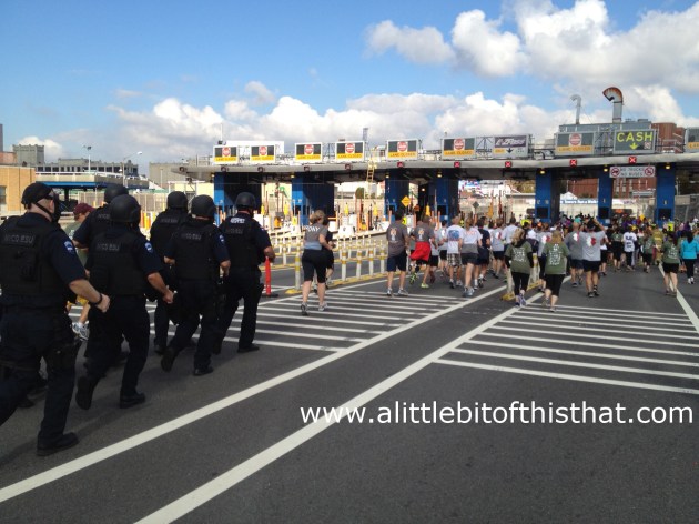 Running towards the toll booth... "Did anyone remember to bring the E-Z Pass?" (Also, check out the men on the left running in gas masks!)